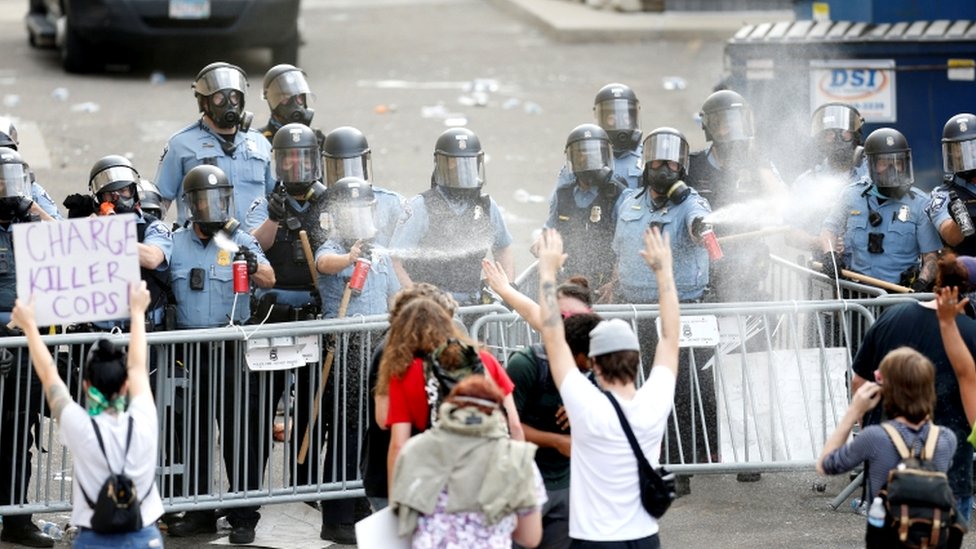 People gather at the Minneapolis Police Department`s Third Precinct station on Wednesday