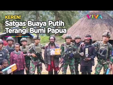 Sisi Terang Dibalik Garangnya Satgas Yonif 323 Kostrad