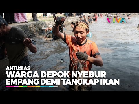 Keseruan Warga Rela Ngubek Empang di Depok Demi Dapatkan Ikan
